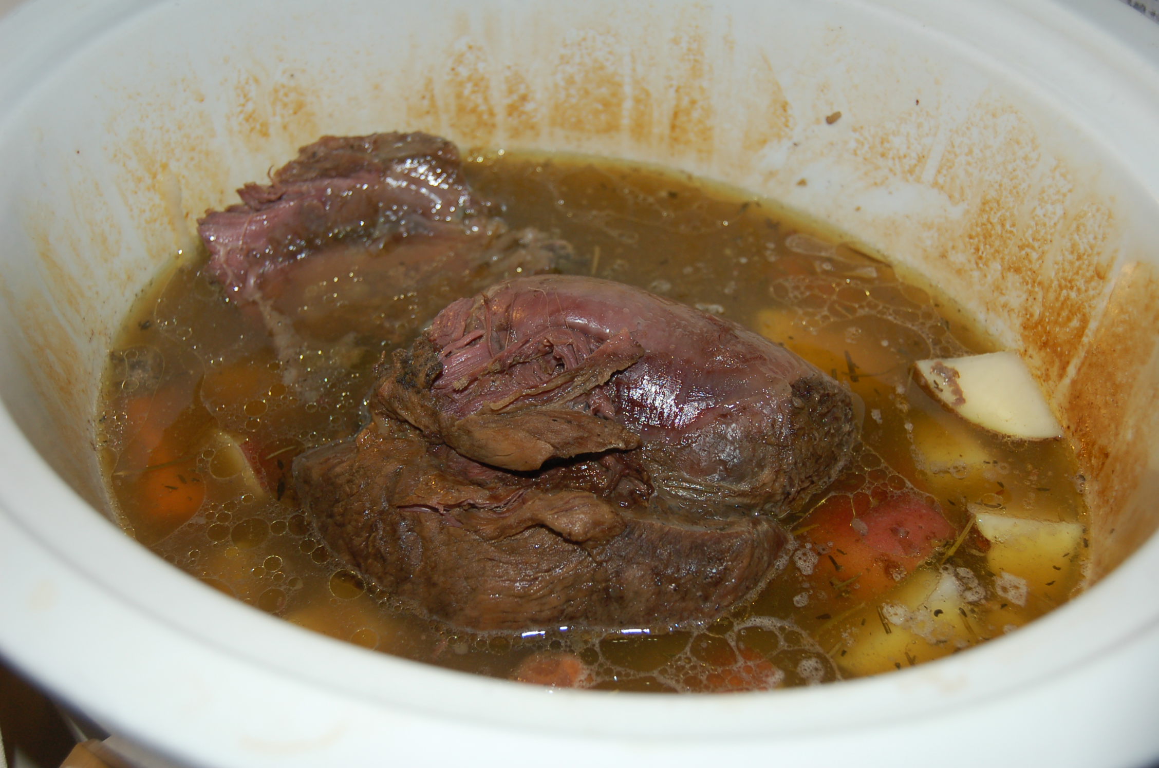 How much water should you put in with a pot roast in a Crock-Pot?
